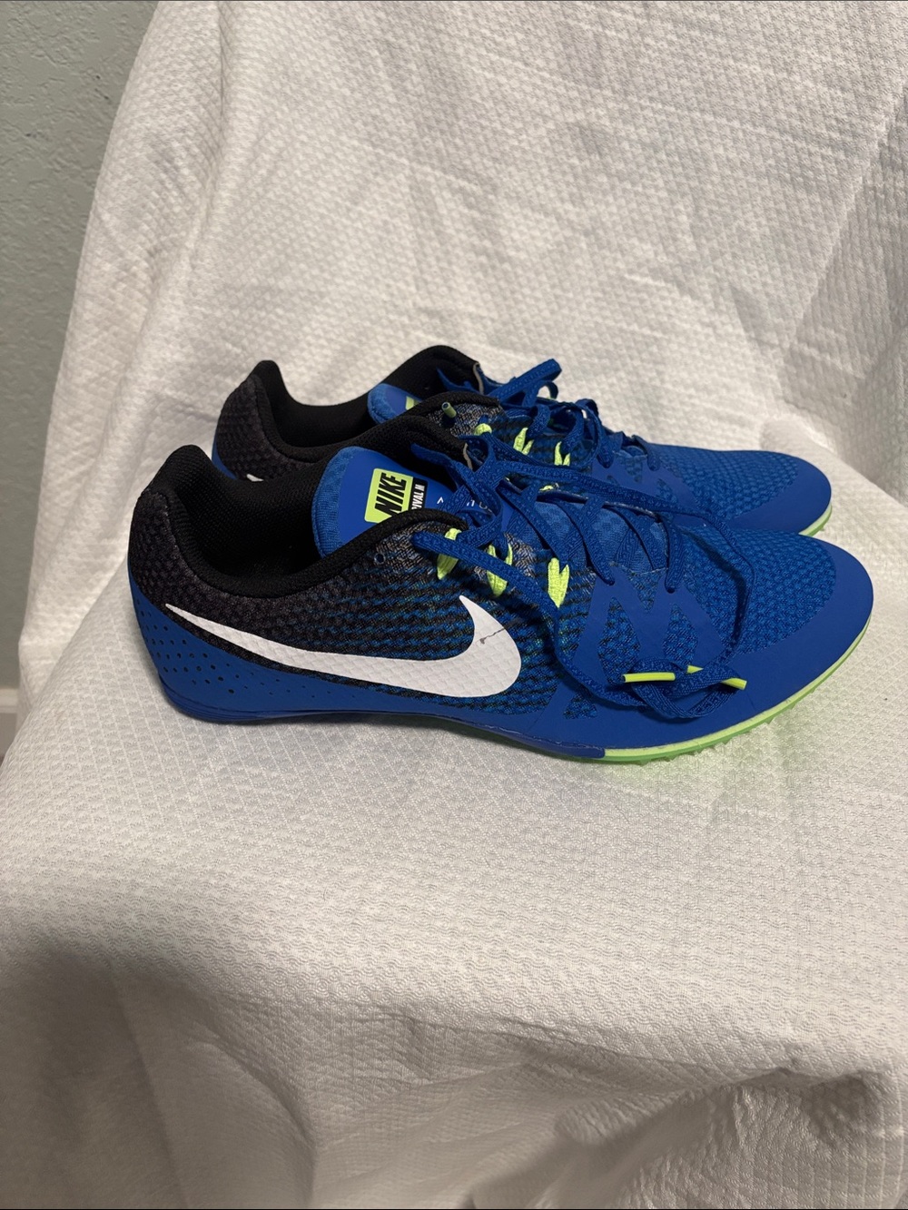 Nike Blue Running Shoes with White Swoosh and Neon Green Accents